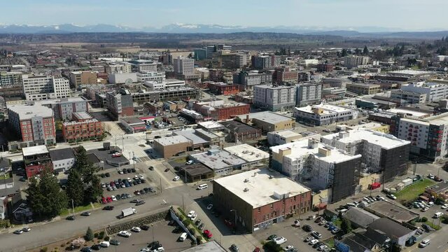 Cinematic aerial drone view of downtown Everett, Bayside, Port Gardner, neighborhoods near the Boeing Everett Factory, bedroom communities North of Seattle on the shores of Puget Sound in Washington
