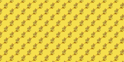 Metal shopping carts with a orage handle on an Illuminating background with shadows as a sample for the mockup. Purchase. Flat lay