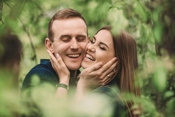 Portrait of emotional young couple hugging each other tightly, boyfriend and girlfriend, love you so much, strong affection in relationship