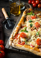 square pizza with tomatoes and cheese