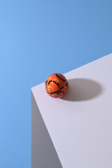 Decorated easter egg in minimal style on table in front of blue background