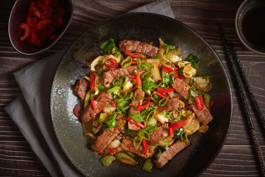 Asian Food: Homemade Beef and Pak Choy Stir Fry with Teriyaki Sauce, dark and moody style food photography
