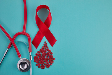 Awareness oncept with blood drop and red ribbon. World Hamophilia day or blood donor day