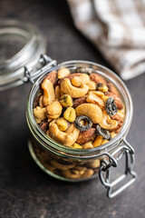 Mix of salted nuts in jar.