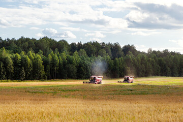 Agricultural machinery goes to work in the field.