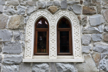 Fototapeta na wymiar Windows in an oriental style of a stone building