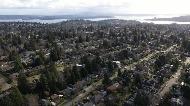 Cinematic Aerial Drone Dolly Shot Of Cowen Park, Seattle Children's Hospital, Roosevelt, Ravenna, Laurelhurst, University District, Lake Washington And Downtown Seattle In The Distance