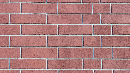 brick wall of bricks of different sizes as the background