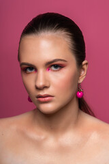 fashion woman, round pink earrings and beautiful professional makeup