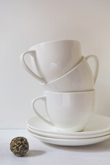 A couple of tea  cups on a white table - 426467706