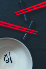 Beautiful set of asian tableware, chopsticks and bowl, top view, background - 426467734