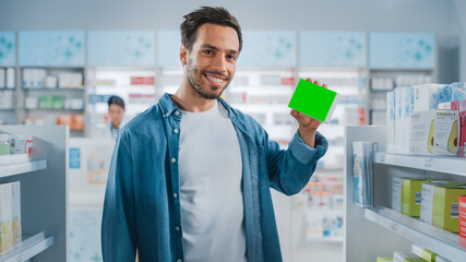 Pharmacy Drugstore: Portrait of Handsome Latin Man Holding Mock-up Template Medicine Package with...