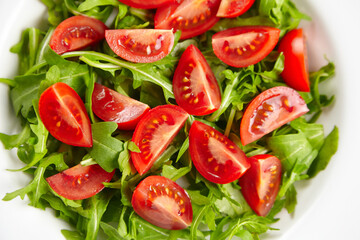 Fresh vegetable salad with tomatoes and arugula, healthy food