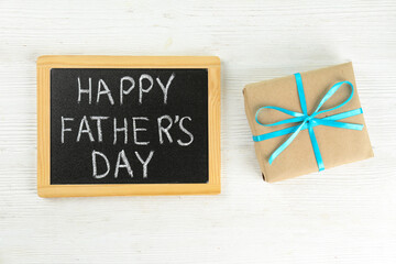 Father's day greeting card concept. Close up composition with symbolic objects on textured background with a lot of copy space for text. Top view, flat lay.