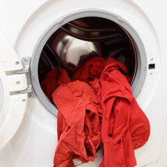 Broken laundry in the basket rotor of an front loading automatic washing machine wringing, damage to clothes during washing