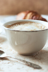 Coffee with milk on bright stone background. Close up.	