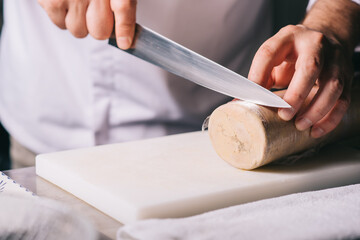 restaurant chef cutting foie gras - obrazy, fototapety, plakaty