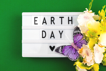 Earth day holiday concept background with text message on a lightbox