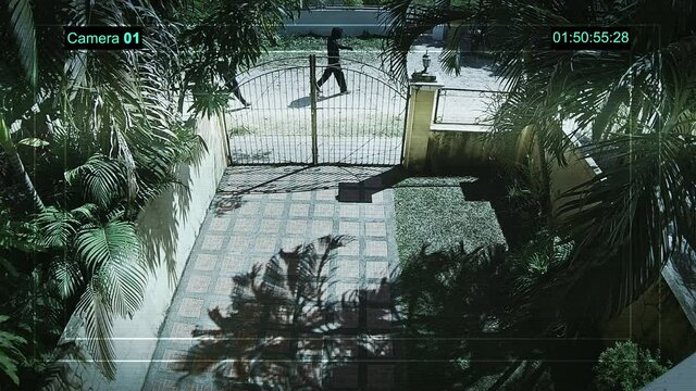 Real surveillance camera recorded 4K two criminals close near the rich house.