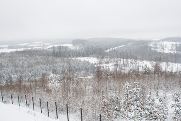 View of valleys and plateaus in Germany covered in snow in winter.