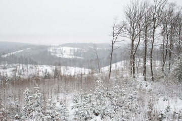 View of valleys and plateaus in Germany covered in snow in winter.