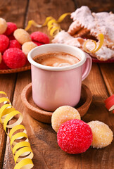 Espersso coffee Traditional sweet pastries during the carnival period in italy. Street food, round biscuits with sugar for the carnival of Venice. High quality photo