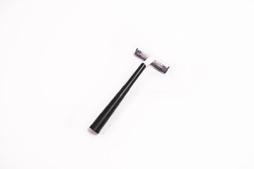 One black disposable razor isolated on white background
