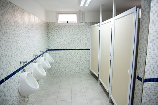 Public Restrooms Of The School. With Modern Design, New Hand Wash, Beautiful Colored Tiles, Faucet With Mirror And Window.