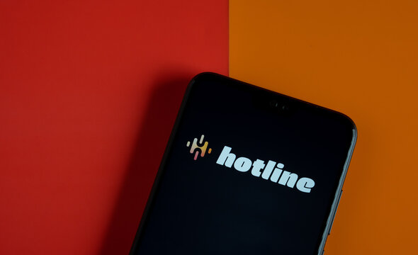 Hotline app logo seen on the smartphone. Hotline platform is a new drop in audio chat developed by Facebook, competitor to popular Clubhouse app. Stafford, UK, April 8, 2021