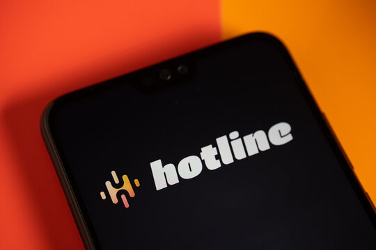 Hotline app logo seen on the smartphone. Hotline platform is a new drop in audio chat developed by Facebook, competitor to popular Clubhouse app. Stafford, UK, April 8, 2021