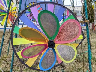 colorful wheels windmill outdoors close up photo