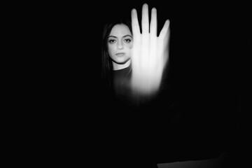 Blurred female portrait in the dark.