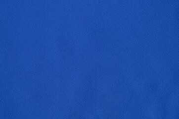 The texture of the blue chiffon fabric. The structure of the silk fabric.
