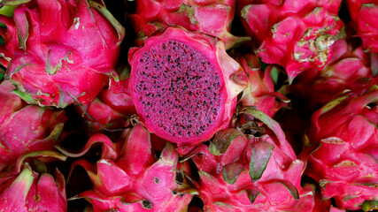 Dragon fruit slices. Looks fresh, black seeds are clearly visible. Focus selected