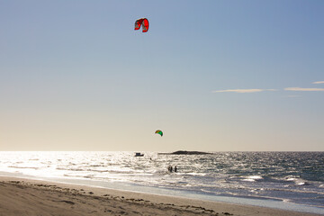 Athletes Practicing Kite Surf and Wind located in the beach at Jericoacoara Brazil