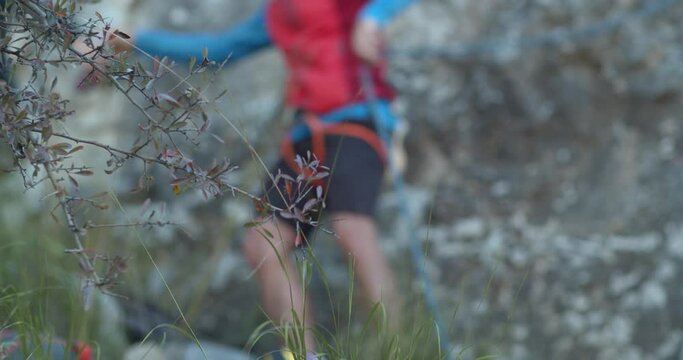 Rock climber putting on his equipment