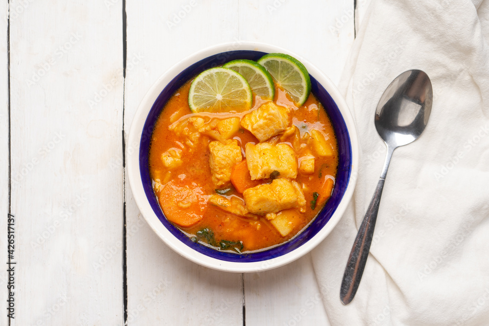 Sticker Fish soup with vegetables on white background. Mexican food