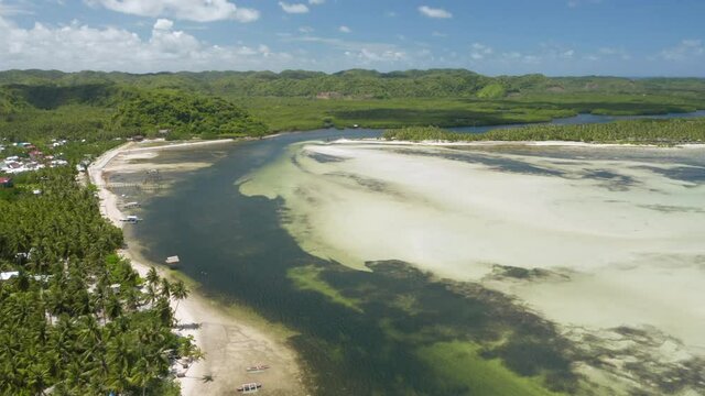 Aerial showing bay between Union Beach and Doot Beach nearby General Luna, Siargao Island, Philippines.