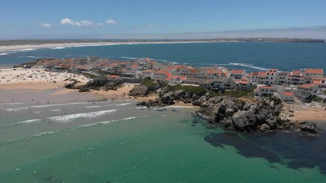 Aerial view of two beaches, Atlantic ocean, typical portuguese house, Baleal peninsula at Peniche, Portugal