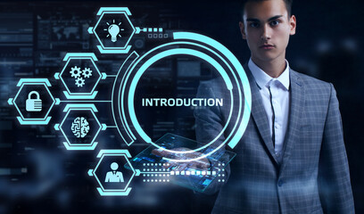 Business, Technology, Internet and network concept. Young businessman working on a virtual screen of the future and sees the inscription: Introduction.