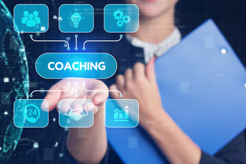 Business, Technology, Internet and network concept. Young businessman working on a virtual screen of the future and sees the inscription: Coaching