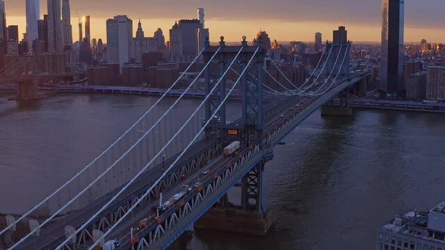 Aerial drone shot over Manhattan Bridge and Ney York skyscrapers at dusk