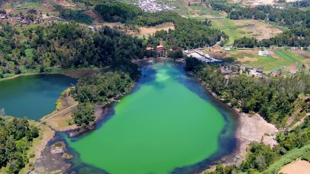 Scenic aerial view of volcanic Lake Warna at Dieng plateau, Java, Indonesia