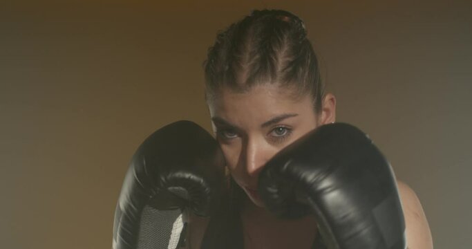 Female kick-boxer punching
