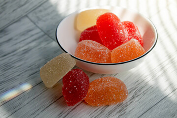 Multi-colored marmalade on the table. Jelly candy with sugar on top.