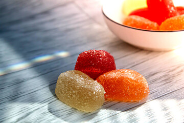 Multi-colored marmalade on the table. Jelly candy with sugar on top.