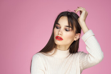 Fototapeta premium Beautiful brunette red lips white blouse close-up attractive view pink background