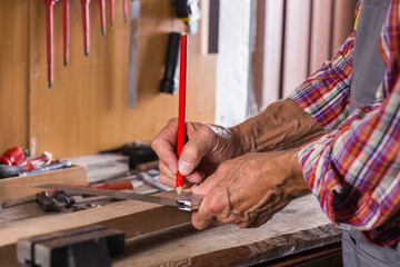 Carpenter working on the work bench, joinery tools and woodwork