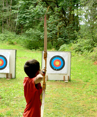 Boy participating in Boy Scouts of America run archery event.