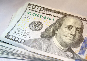 Stack of USD 100 dollar bills.